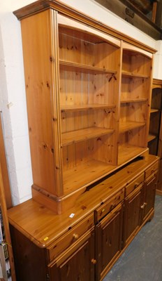 Lot 1068 - A pine sideboard, the top with a rounded edge...