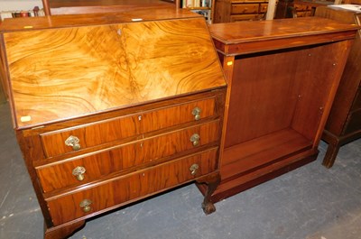 Lot 1075 - An early 20thC walnut bureau, the fall above...