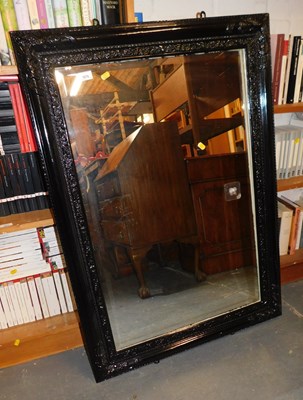 Lot 1076 - A black painted mirror, with a rectangular...