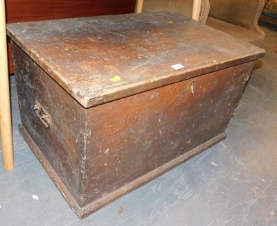 Lot 1086 - A stained pine chest, the hinged lid enclosing...