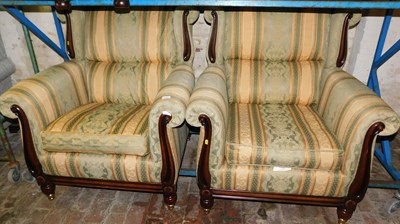 Lot 1097 - A pair of wingback armchairs, with striped...