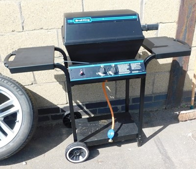 Lot 1111 - An OMC gas barbecue, with cover.