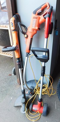 Lot 1186 - A Black and Decker electric strimmer, another,...