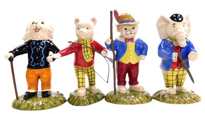 Lot 675 - Four Royal Doulton Rupert figures, comprising...