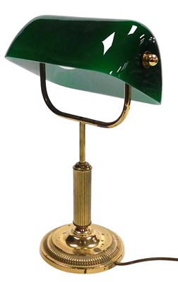 Lot 645 - A brass angular table lamp, with a green and...