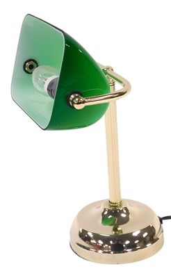 Lot 654 - A brass table lamp, with a green and white...