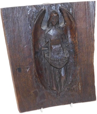 Lot 661 - A late 19thC oak holy water font, carved in...