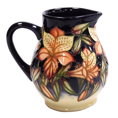 Lot 668 - A Moorcroft pottery Peruvian Lily pattern jug,...