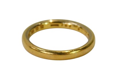 Lot 73 - A 22ct gold wedding band, size L½, 5g.