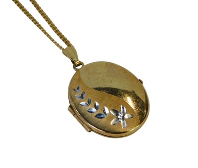Lot 75 - A 9ct gold locket, of oval form, with white...