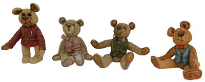Lot 214 - Four Royal Doulton Company Material Bears...