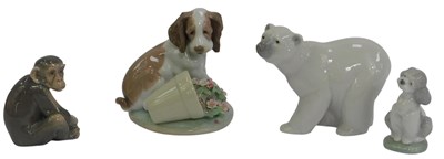 Lot 217 - Four Lladro porcelain figures, modelled as a...