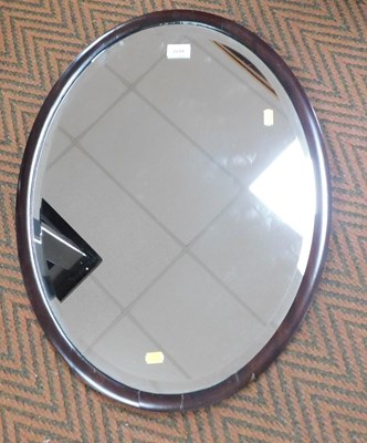 Lot 2219 - An early 20thC mahogany framed oval wall...