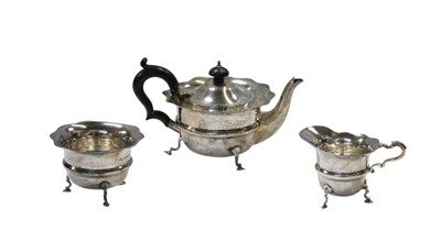 Lot 23 - A George V silver three-piece tea service,...
