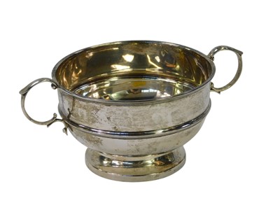Lot 26 - A George V silver twin handled cup, with...