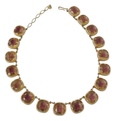 Lot 347 - A simulated amethyst banded citrine riviere...