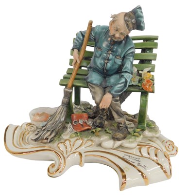 Lot 380 - A Capodimonte porcelain figure modelled as...