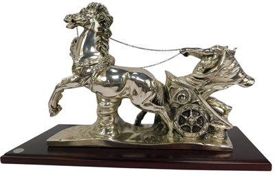 Lot 334 - A 20thC silvered resin model of a charioteer...