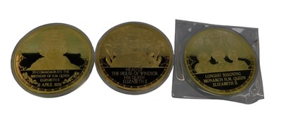Lot 194 - Three Elizabeth II commemorative gold plated...