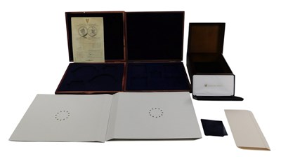 Lot 200 - A group of coin presentation boxes and sleeves,...