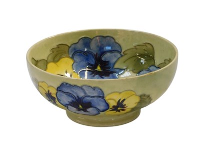 Lot 423 - A Moorcroft pottery Pansy pattern bowl, pale...
