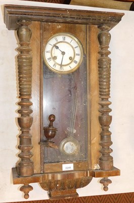 Lot 2249 - A late 19thC continental oak cased wall clock.