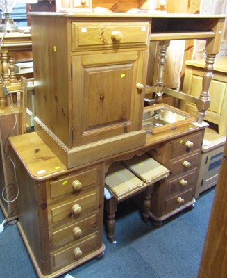 Lot 1005 - A pine twin pedestal kneehole desk, of eight...