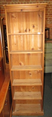 Lot 1056 - A pine freestanding bookshelf, of five shelves,...