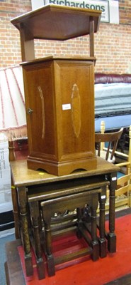 Lot 1058 - An oak nest of three tables, and an oak...