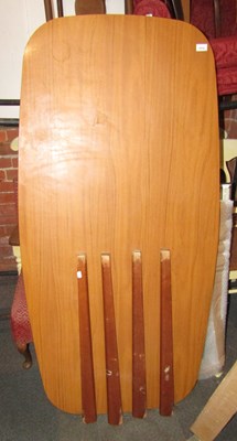 Lot 1014 - A dining table, with a formica finish, raised...