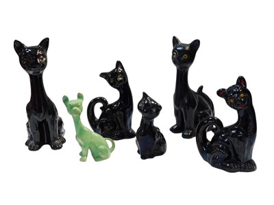 Lot 439 - A group of pottery cats, to include five black...