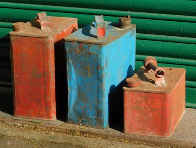 Lot 561 - Three fuel cans, two painted red, the other blue.