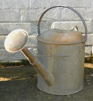 Lot 566 - A galvanised metal two gallon watering...