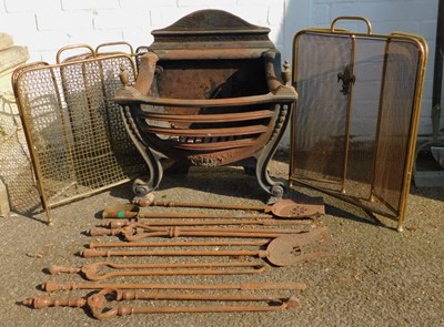 Lot 567 - A cast iron and brass fire basket, 75cm...