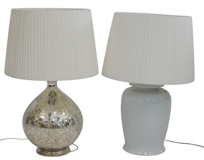 Lot 580 - A contemporary glass table lamp, of spherical...