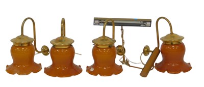 Lot 590 - A set of four brass wall lights, each with an...