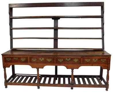 Lot 627 - An 18thC oak dresser, the top with a four...