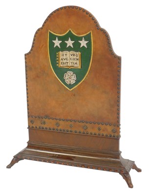 Lot 633 - A 20thC mahogany and leather firescreen, the...