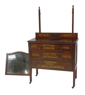 Lot 637 - An early 20thC oak sign written mirror back...