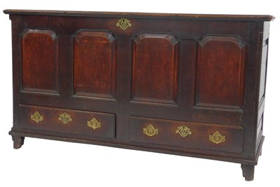 Lot 653 - An 18thC oak mule chest, the hinged lid...