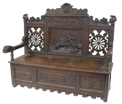 Lot 654 - A Victorian oak settle, the carved back...