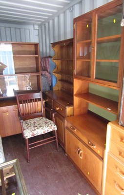 Lot 1124 - A modern teak display cabinet, with two glazed...