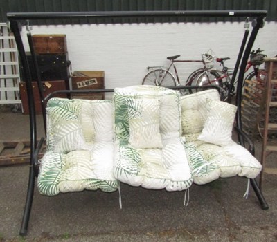 Lot 1139 - A tubular metal three seat garden swing seat,...