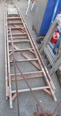 Lot 1146 - A large set of wooden A frame step ladders.