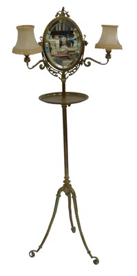 Lot 665 - A brass shaving stand, the top with an oval...