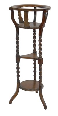 Lot 668 - An early 20thC oak jardiniere stand, the top...