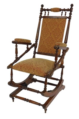 Lot 685 - An early 20thC American mahogany rocking chair,...