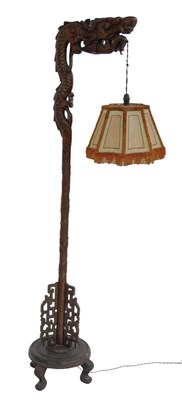 Lot 687 - An Oriental influence carved hardwood standard...