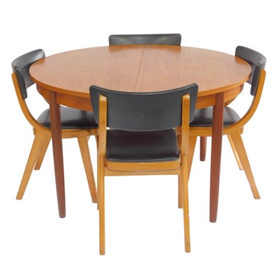 Lot 692 - A 1970s G-Plan style teak extending dining...