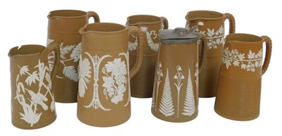 Lot 344 - A group of late 19thC brown sprig moulded jugs,...